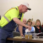 farmer pours fracking water