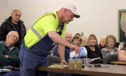 farmer pours fracking water