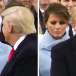 melania frowning behind trump